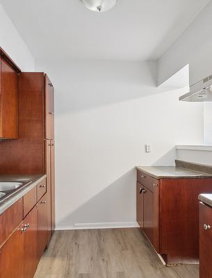 Kitchen with wood cabinets in a 1-bedroom New Orleans East home