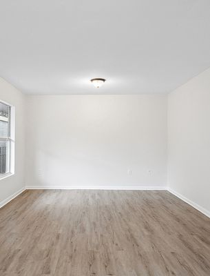 Room with plank floor and doorway in a 1-bedroom New Orleans East home