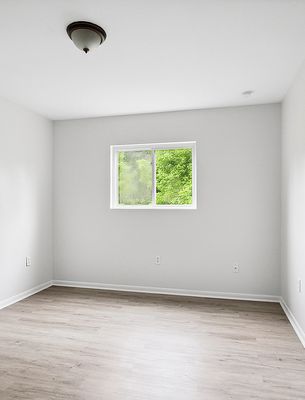 Bedroom with window in a 1-bedroom New Orleans East home