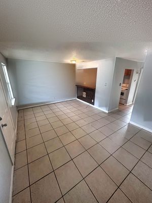 Living room with tile floor in a 1-bedroom New Orleans East home