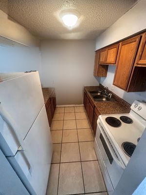 Kitchen with wood cabinets in a 1-bedroom New Orleans East home