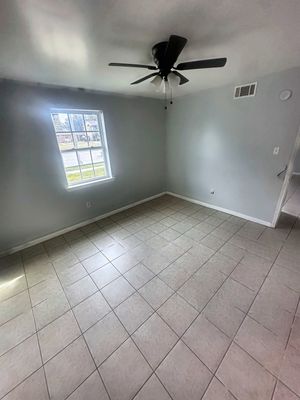 Room with ceiling fan and window in a 1-bedroom New Orleans East home