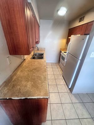 Kitchen with wood cabinets in a 1-bedroom New Orleans East home