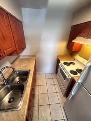 Kitchen with sink and stove in a 1-bedroom New Orleans East home