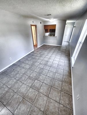 Living room with tile floor in a 2-bedroom New Orleans East home